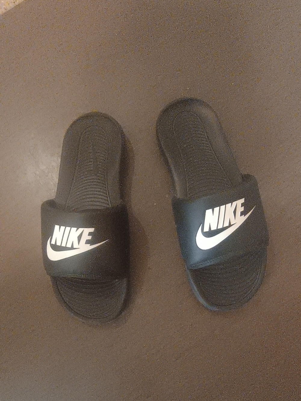Nike Black Slides with White Swoosh Logo